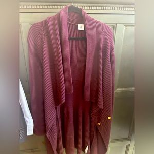 This is a long Cabi cárdigan. Size medium. Burgundy in color.